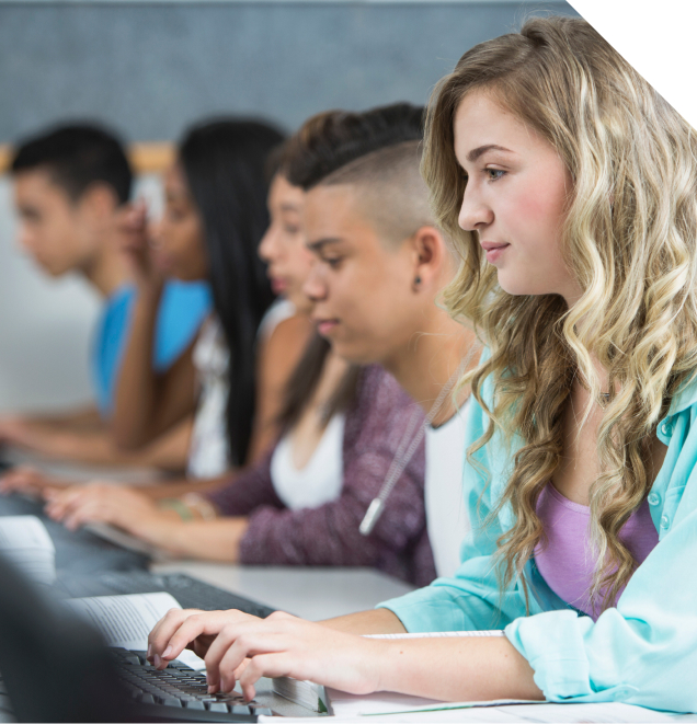Students working at computers in a classroom